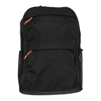 A black backpack with two orange zipper pulls, shown against a plain white background. The brand name Byrna is subtly printed in dark gray on the upper front.