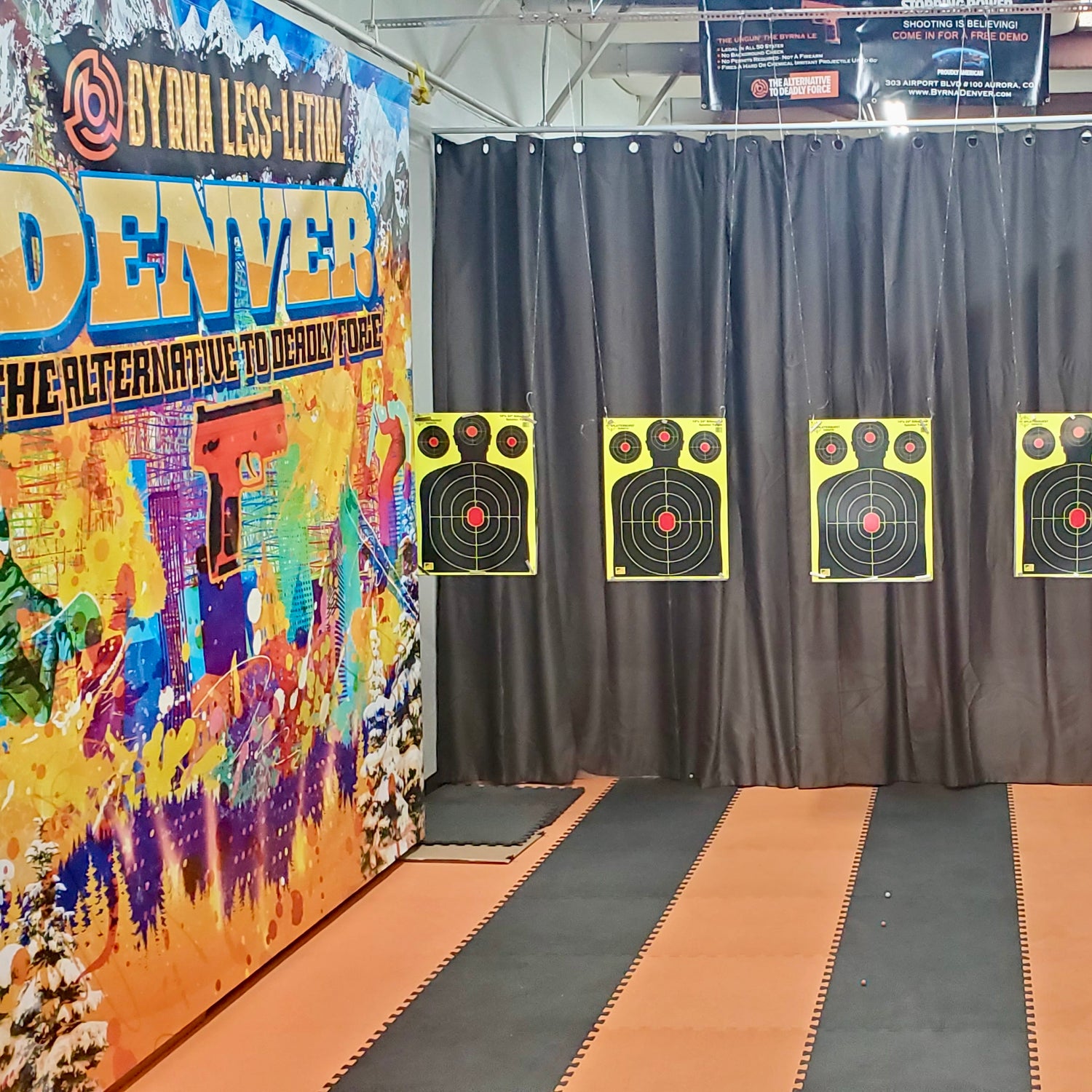 Byrna Denver 4 lane indoor shooting range with hanging splat targets.