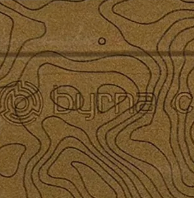 Close up of Bronze Cerekote CL engraved topographic map lines pattern.